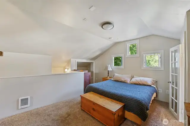 Bright and roomy primary bedroom.