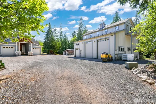 As you approach the home you will see the very large 3 bay shop, with the 30KW generator system to run the home.
