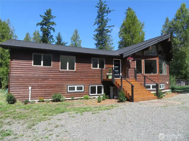 Private, situated on five level acres surrounded by trees, the surrounding area will not be developed.