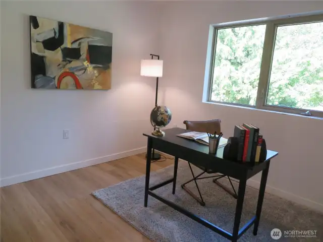 Third upper level bedroom facing the back of the home and staged here as an office space.