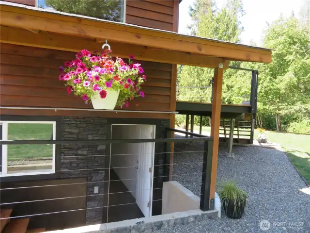 The lower level is unfinished and has its own two separate exterior entries.  This is the main entry on the east side of the home.