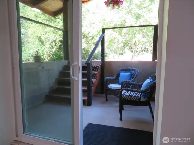 Second lower level entry faces the back of the home and slider shown here.