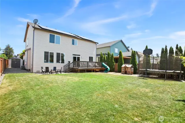 Large, flat backyard - slide off deck and play equipment for kids