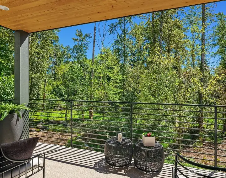 Covered outdoor living with beautiful views of the nature preserve