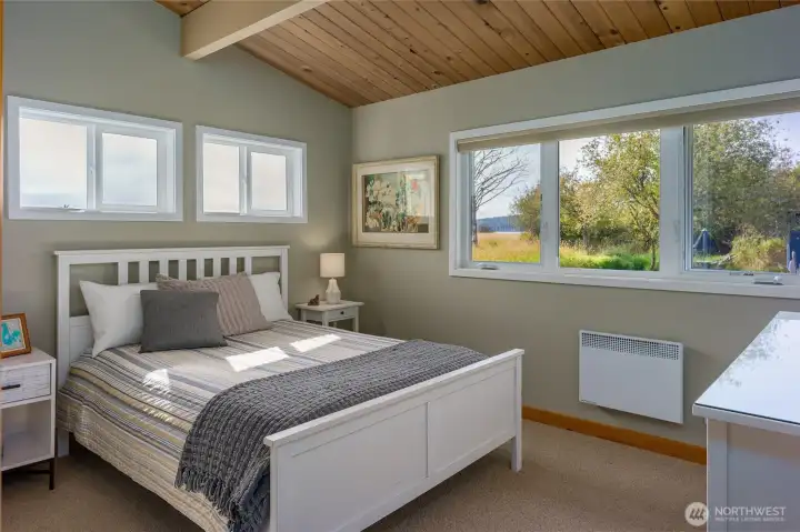 Primary bedroom is light and bright.