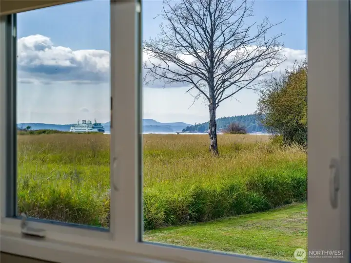 View out the bedroom window with ferry passing.