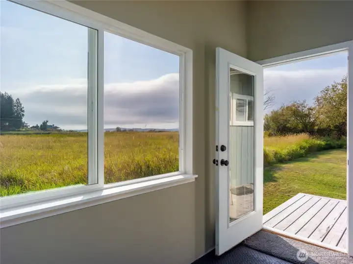 Sunroom opens to a little back porch.