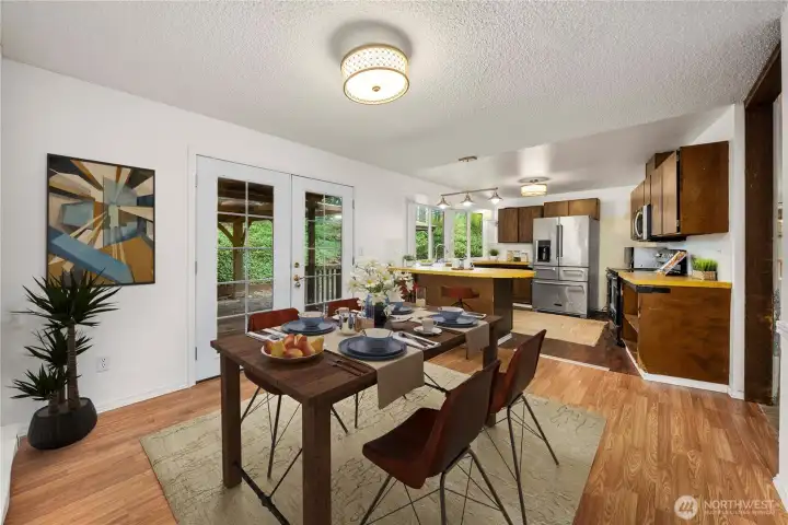 Virtually staged eat-in area of kitchen.