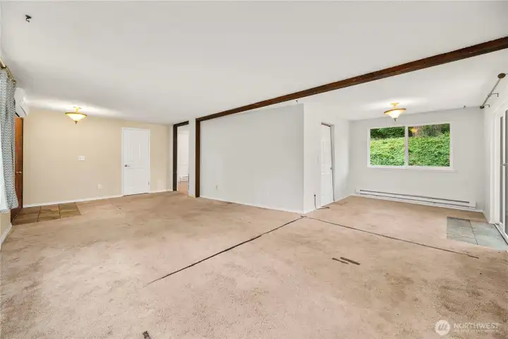 Wide view of the dining and living rooms.