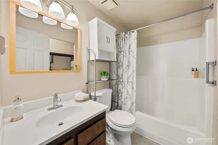 Full bath located in the hall near Bedrooms #2 and #3.