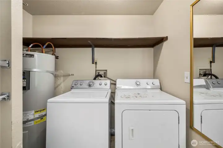 The laundry is conveniently located in the full bathroom.