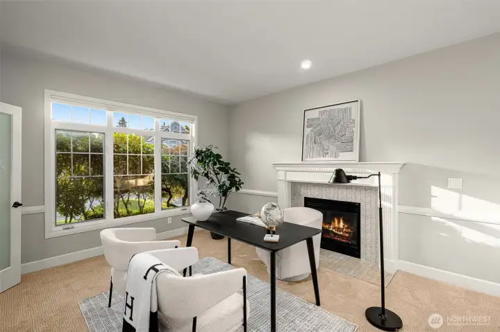 Desirable main floor office with a fireplace and dual doors. To the left as you enter the front door.