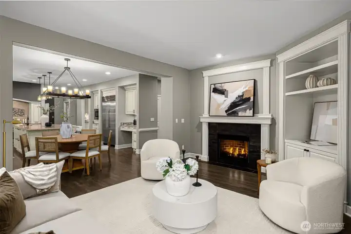 Family room off kitchen has gas fireplace and built-ins
