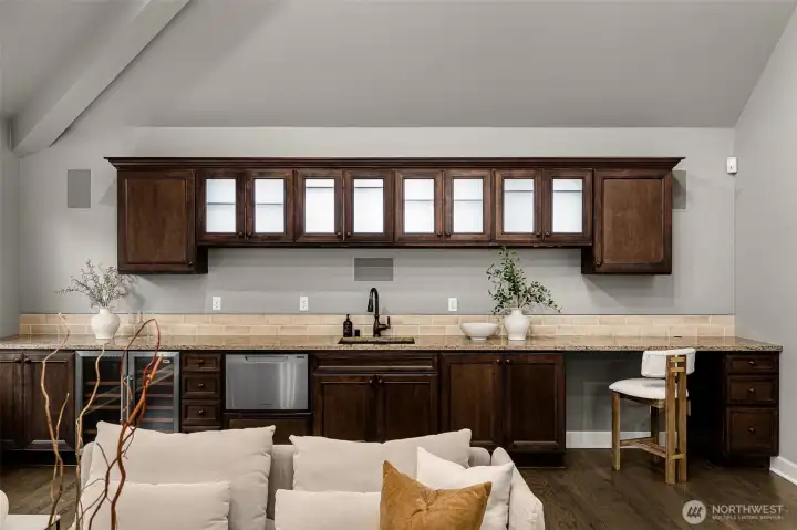 Entertainment room has a wet bar, dishwasher & wine fridge