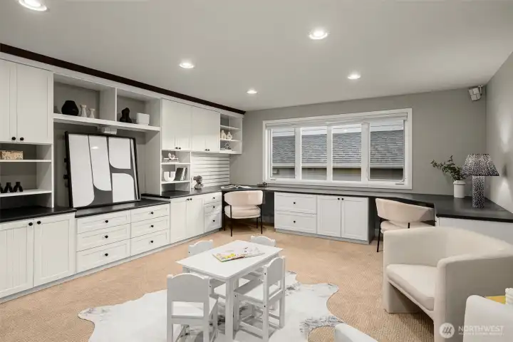 Upstairs bonus play room has kids homework stations built-in