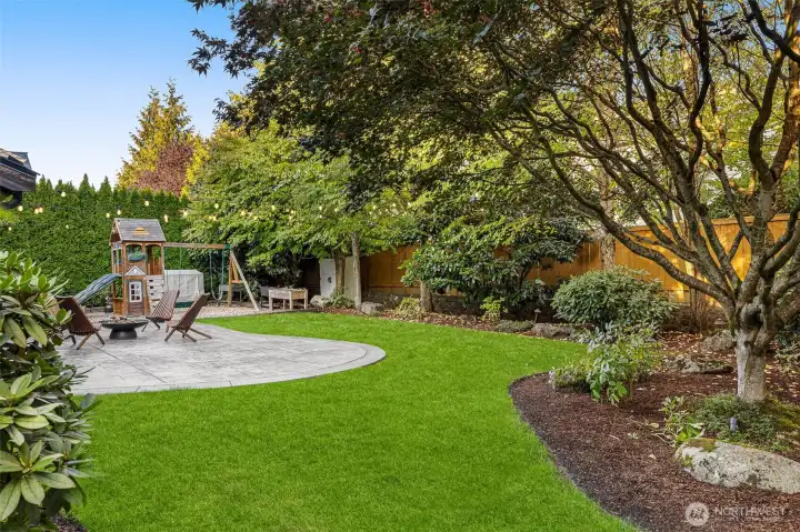 Beautifully landscaped, private yard has plenty of room for playing and entertaining