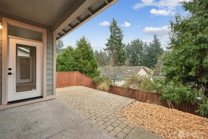 This covered patio is an easy win. Step straight out from the kitchen eating nook and into a low maintenance backyard that’s designed for actual use. The extended paver patio gives you room to lounge, dine, or entertain without turning yard care into a second job. Treetop views add a sense of privacy and calm, while the well placed evergreen creates a natural buffer between neighbors.