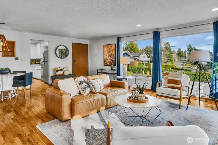 You enter into a bright and spacious living area.