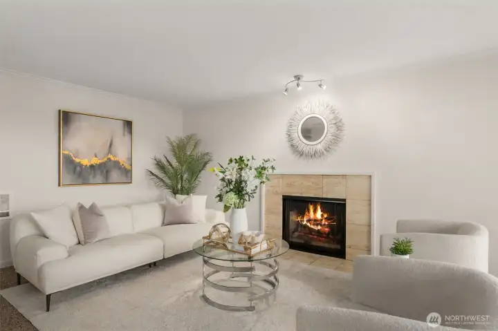 Bright living room with cozy fireplace and Lake Union views.