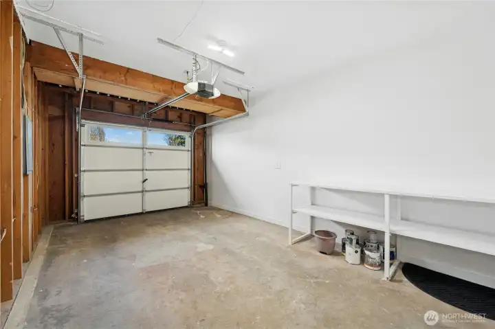 Freshly painted garage with new electric garage door opener.