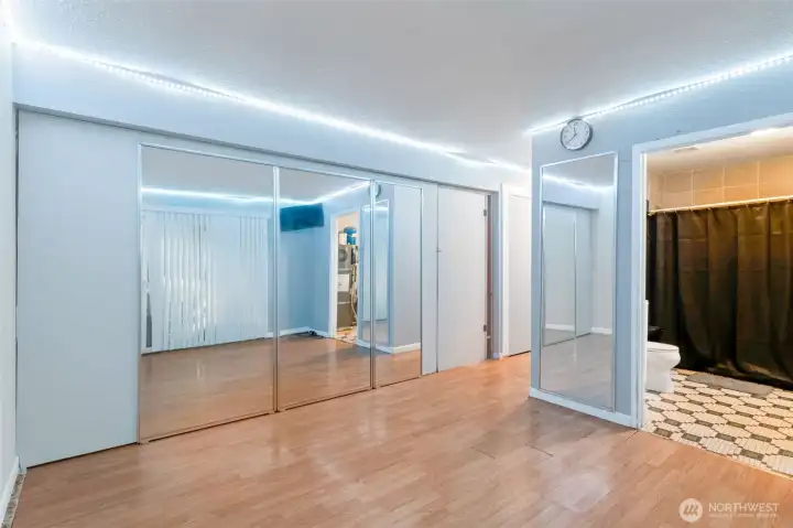 Daylight Basement- wall where mirror is can be removed to open up the room again.