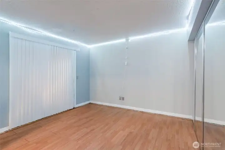 Daylight Basement-wall where mirror is can be removed to open up the room again.