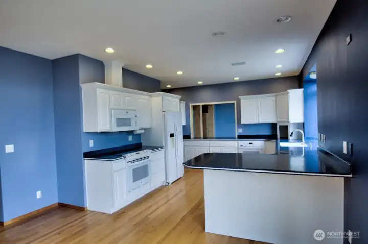 Intelligently designed kitchen leads into the dining room.