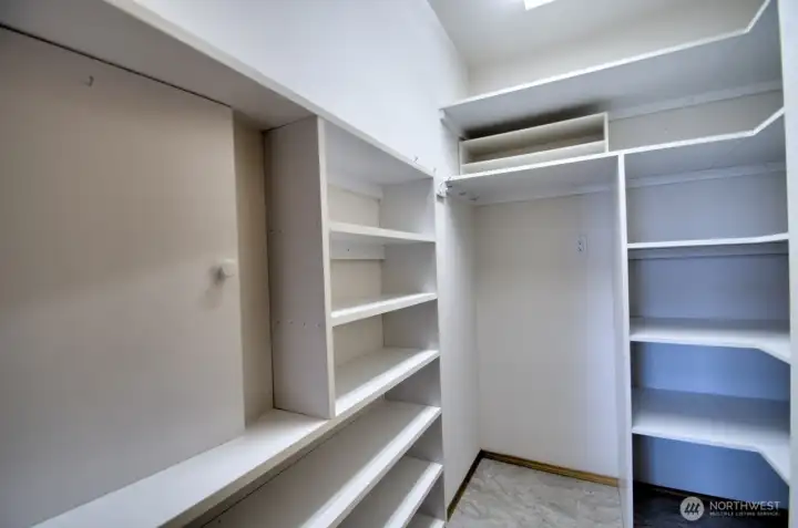 Tile floors in the pantry off of the hallway.