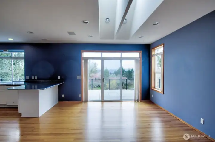 Light streams into the dining room from double skylights and slider to recently updated deck with porcelain tile and view.