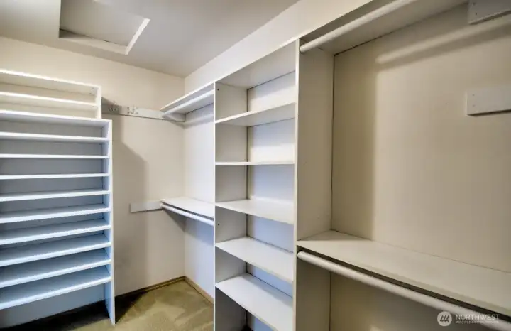 Spacious primary closet with lots of storage.