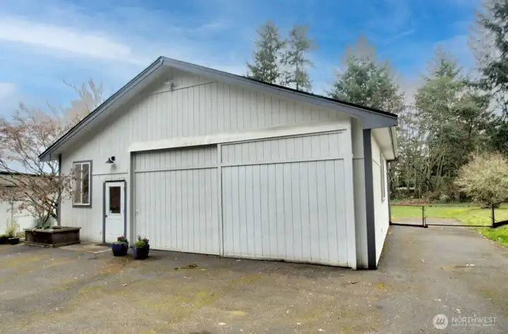 Drive-through RV garage with doors on both sides.