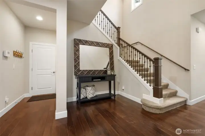Garage door close to kitchen, and space for an upright piano!