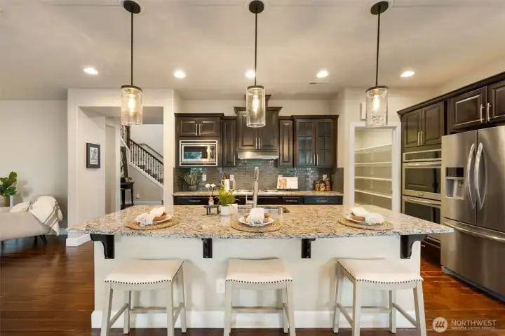 Large kitchen with walk-in pantry and room for 3 stools
