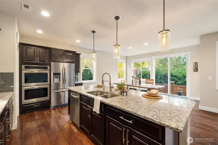 Lots of natural light shining in from private backyard setting