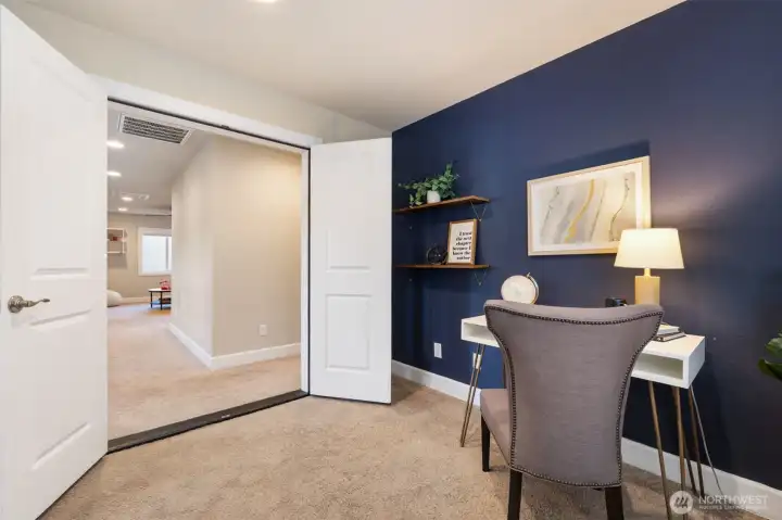 Upstairs office area with French doors