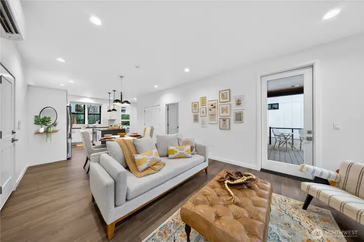 An abundance of light thru the glass doors and ample surrounding windows.