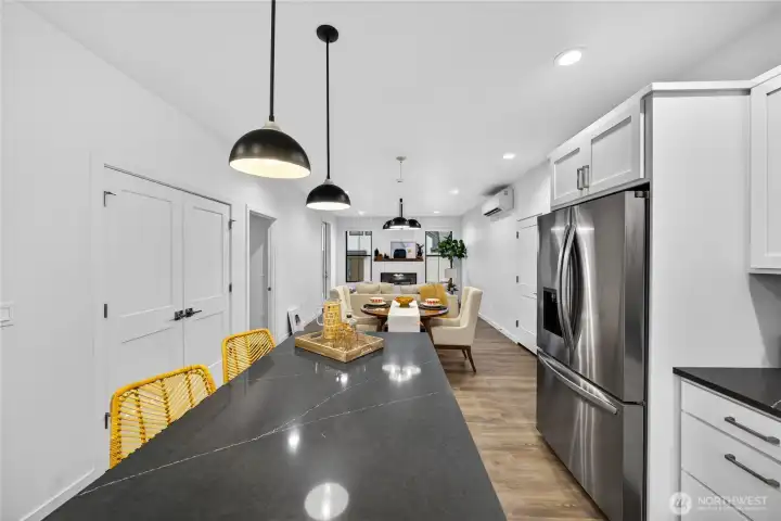 Large kitchen island extends the seating and entertaining space.