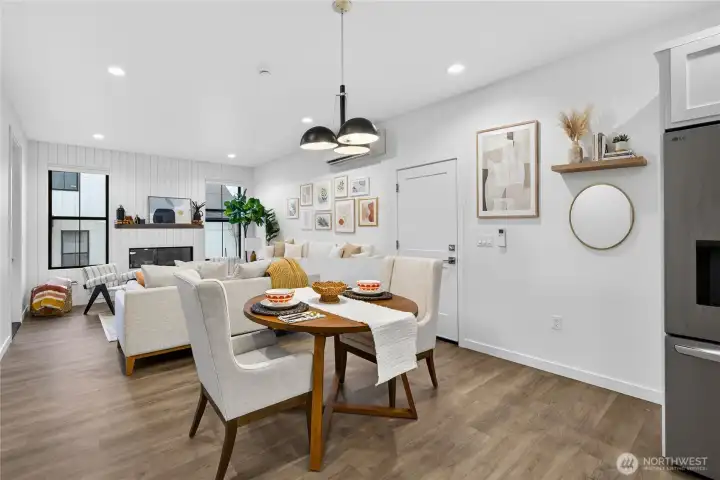 Wall of shiplap surrounds the electric fireplace with mantle.