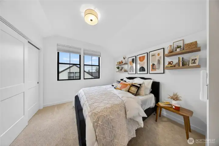 One of the two upstairs bedrooms with large closet space.