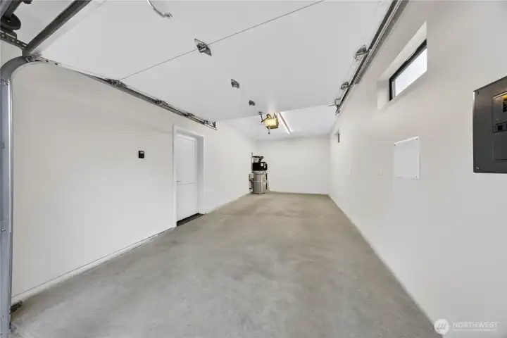 Oversized single car garage has lots of space for storage and vehicle.