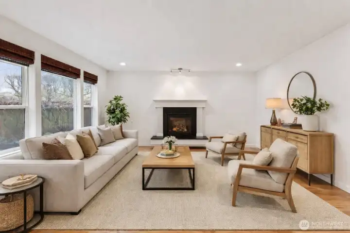 Relax in the cozy living room centered around a gas fireplace (virtually staged)