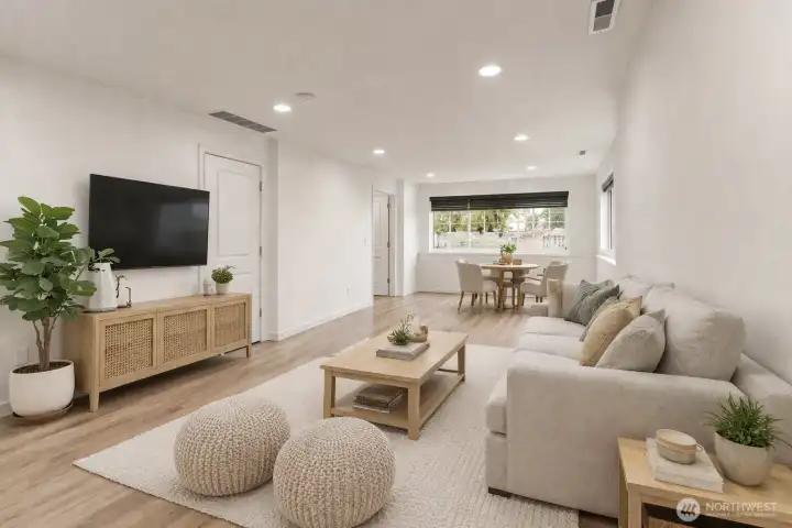 Lower level versatile suite with a bathroom and private entrance from the garage. (virtually staged)