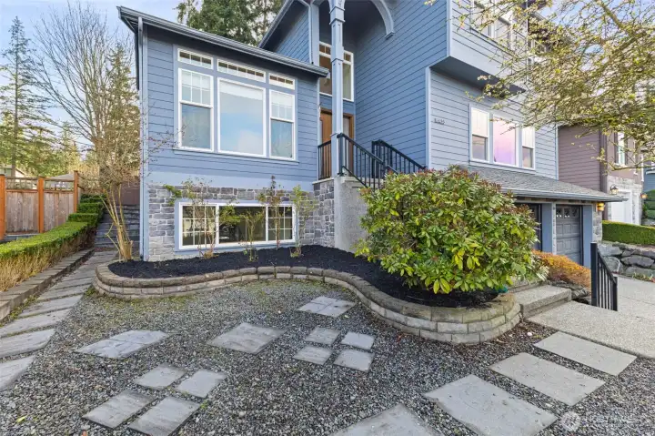 Concrete pavers leads out to the full fenced backyard.