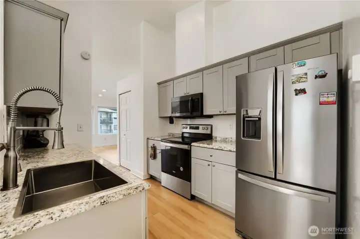 Updated kitchen with sleek new cabinetry.