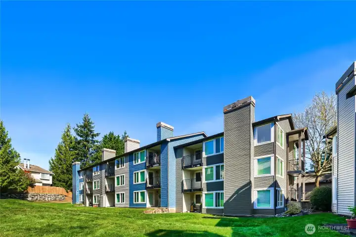 Back exterior overlooking a grassy area.