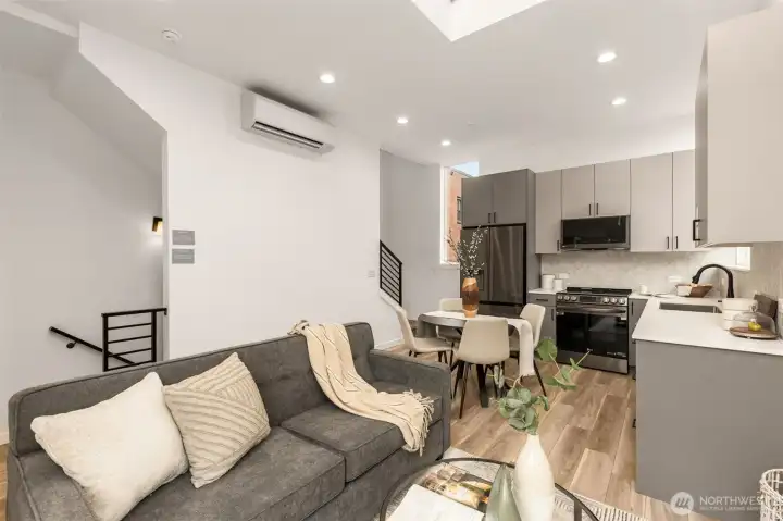 Peek the stairs and built-in efficiency—this home was made for seamless movement and comfortable living. And that mini-split? Quiet and efficient!