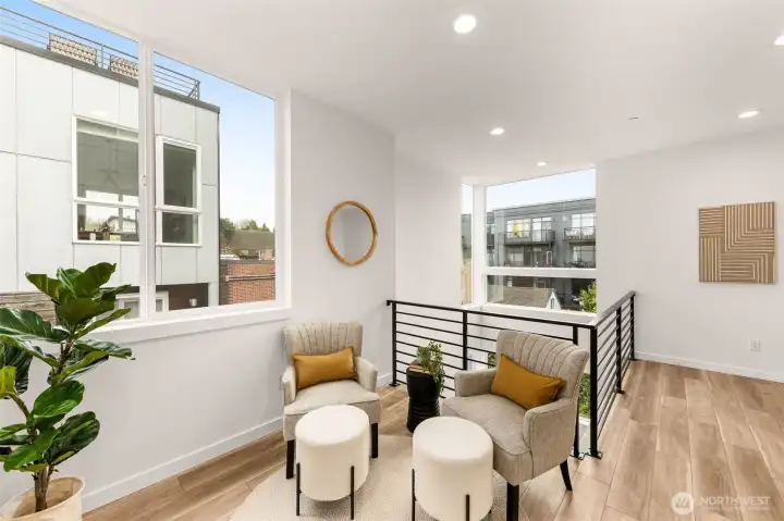 Upstairs moment of calm: curl up in your sun-soaked nook. Work corner? Reading spot? You decide.