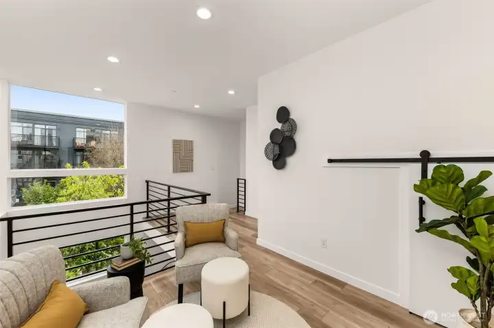 Natural light pours in from every angle here. This lofted flex area is your blank canvas for creativity.