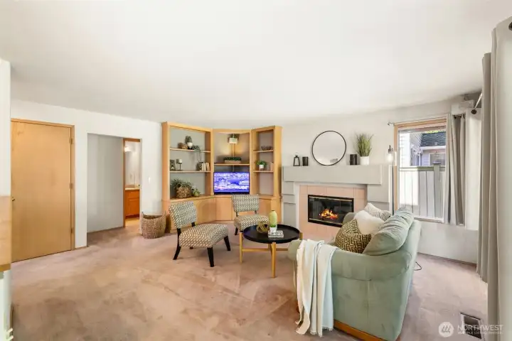 Comfort meets convenience in this Family Room anchored by a classic gas fireplace just steps from the Kitchen.