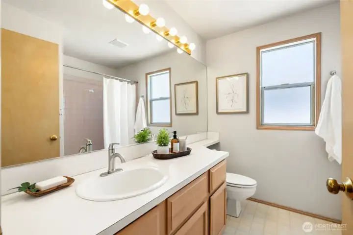 Well-positioned to serve the secondary bedrooms with clean finishes and plenty of storage.